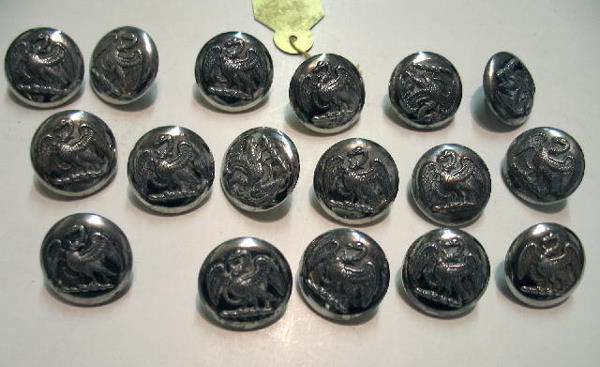 FORTY SEVEN BUTTONS. English livery, silver plate