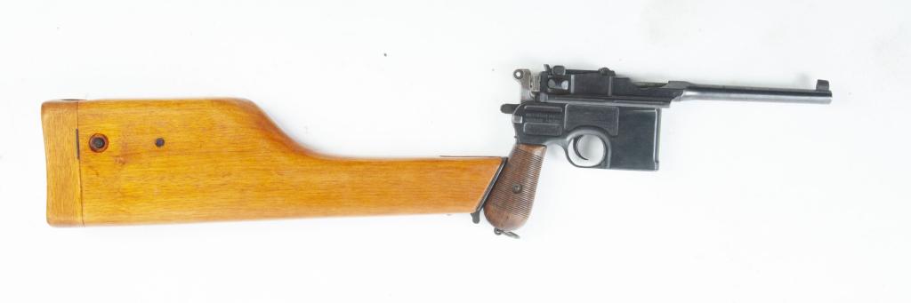 *GERMAN MAUSER C96 BROOMHANDLE SEMI-AUTO PISTOL: GERMAN MAUSER C96 BROOMHANDLE Wartime Commercial SEMI-AUTOMATIC SIX-SHOT PISTOL WITH UNMARKED STOCK/HOLSTER. Between 1915-1921. Blued frame, walnut grips with 34-grooves, adjustable rear site, frame m