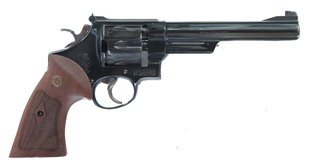 *SMITH & WESSON MODEL OF 1955 .45 ACP REVOLVER: SMITH & WESSON MODEL OF 1955 .45 ACP REVOLVER. American, 20th century. Blued finish, fluted barrel, and checkered walnut grips. 6.5" barrel, 11.75" overall. S/n 57288. *Requires ATF Form 4473.