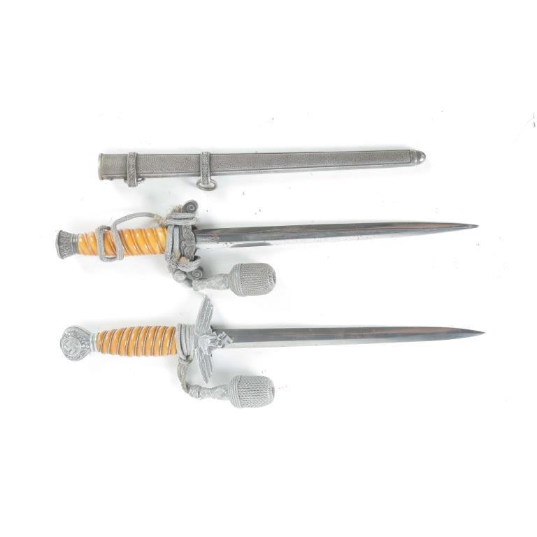 TWO WWII GERMAN DRESS DAGGERS.: TWO WWII GERMAN NAZI DRESS DAGGERS. Germany, 2nd quarter-20th century. "WKC, Solingen" with Bakelite handle, crown pommel, Imperial Eagle, 15.75"l., and one marked "Eickhorn, Solingen" with Imperial E