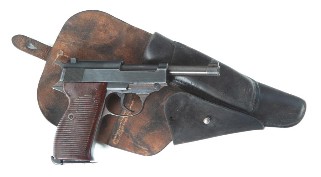 *GERMAN WWII MAUSER P.38 "BYF134" PISTOL AND HOLSTER: GERMAN WWII MAUSER P.38 "BYF134" PISTOL AND LEATHER HOLSTER. Germany, 2nd quarter-20th century. Blued frame, bakelite grips, German proof marks including the Imperial Eagle and swastika, and "WaA135" 