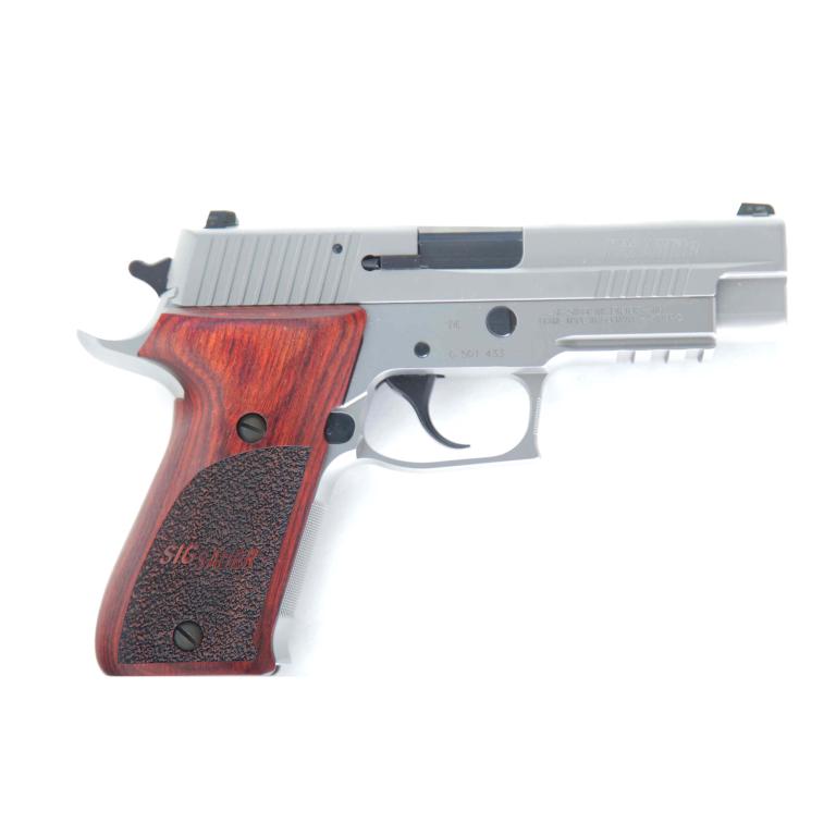 *SIG SAUER P220 ELITE .45 ACP SEMI-AUTOMATIC PISTOL: SIG SAUER P220 ELITE .45 ACP SEMI-AUTOMATIC PISTOL. American, 21st-century. Stainless steel finish, front cocking serrations, SIGLITE\xa8 night sights, and custom wood grips. 4.41" barrel length, 8.5"