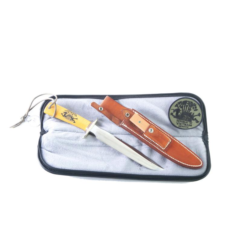 RANDALL KNIVES MODEL 1 1ST ISS VIETNAM VETERAN 8": RANDALL KNIVES MODEL 1 - 1ST ISSUE VIETNAM VETERAN 8". CA. 1987. Stainless steel blade etched VIETNAM VETERAN, double nickel silver hilt, red, white and blue spacers, and yellow Westinghouse micarta h