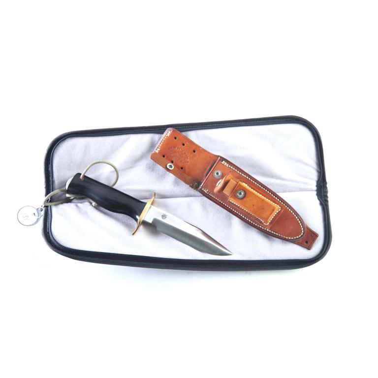 RANDALL KNIVES MODEL 15 - 5.5" BLADE: RANDALL KNIVES MODEL 15 - 5.5" BLADE. Black "border patrol" style micarta handle, brass double hilt, full tang, and wrist thong. 10.25" overall. Includes Randall Knives leather sheath.