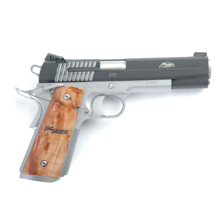 *SIG SAUER 1911 STX .45 ACP SEMI-AUTOMATIC PISTOL: SIG SAUER 1911 STX .45 ACP SEMI-AUTOMATIC PISTOL. American, 21st-century. Two-tone finish with Nitron slide over natural stainless frame, match grade barrel, and custom wood grips. 5" barrel length, 9