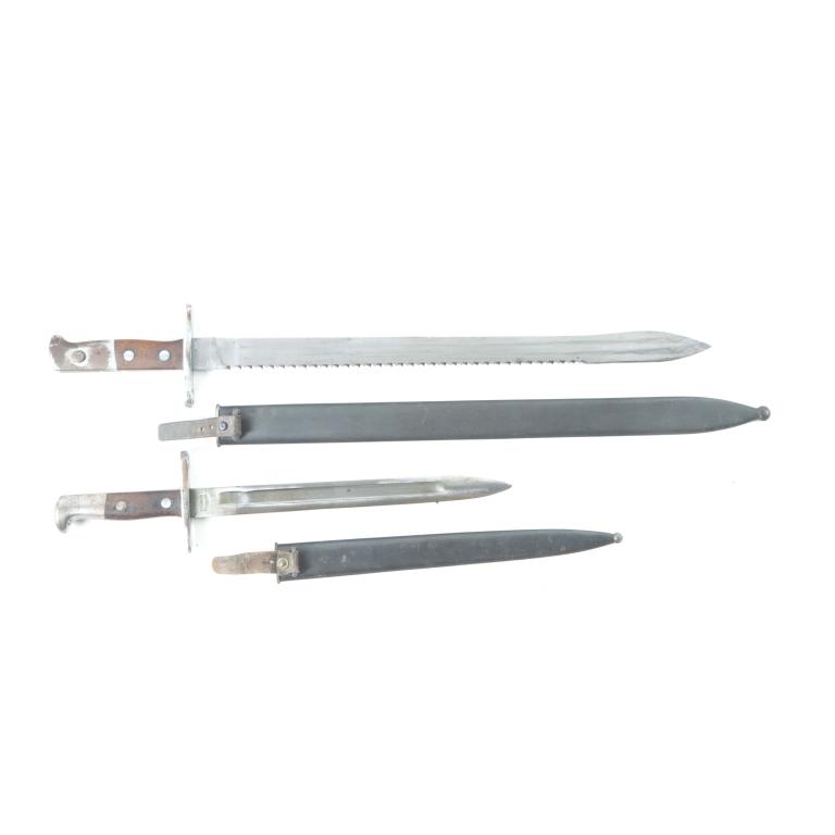TWO GERMAN WWII BAYONETS BY WAFFENFABRIK NEUHAUSEN: TWO GERMAN NAZI WWII BAYONETS MANUFACTURED BY WAFFENFABRIK NEUHAUSEN. German, 2nd quarter-20th century. Both with walnut handles, and pinned. Smaller with s/n. 364413, 17.5"l., and a sawback PioneerBa