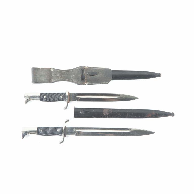 GERMAN WWII BAYONET AND DAGGER: GERMAN WWII BAYONET AND DAGGER. Germany, 2nd quarter-20th century. Bayonet with hardened checkered grips, blade marked "Rich. Abr. Herder, Solingen", leather belt strap, and metal sheath, 15"l., and d