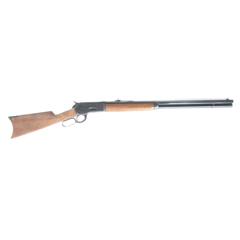 *BROWNING ARMS MODEL 1886 .45-70 GOVT RIFLE: BROWNING ARMS MODEL 1886 .45-70 GOVT RIFLE. American, ca. 1986. Lever action, full-length tubular magazine, blued finish, walnut stock, and crescent butt-plate. 26" barrel length, 45.25" overall. S/n0