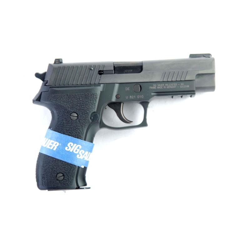 *SIG SAUER P226 .40 S & W SEMI-AUTOMATIC PISTOL: SIG SAUER P226 .40 S & W SEMI-AUTOMATIC PISTOL. American, 21st-century. Black Nitron finish, front cocking serrations, SIGLITE rear night sight, and TruGlo tritium fiber optic front sight. 4.41" barre