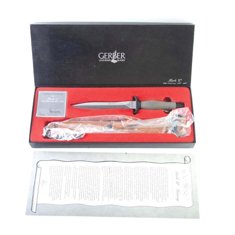 GERBER KNIVES MARK II 6.75" 20TH ANNIV DAGGER: GERBER KNIVES MARK II 6.75" 20TH ANNIV DAGGER. American. 20th anniversary dagger with double edged stainless steel blade and gray die cast aluminum textured handle. 11-7/8" overall length. S/n xx3234.