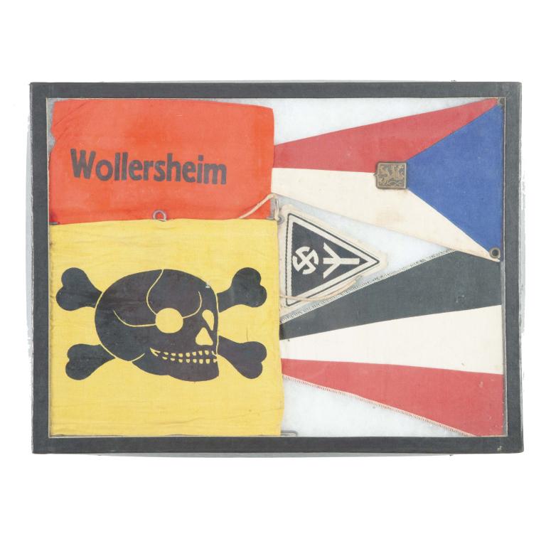 RIKER MOUNT OF SIX TEXTILES: RIKER MOUNT OF SIX TEXTILES. Includes an SS-Panzerdivision textile, red German swastika, "Wollersheim” German volunteer fireman arm band, green, white, and red pennant, blue, red, and white pennant 