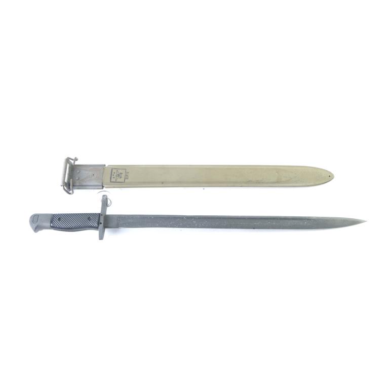 GENERAL CUTLERY M1917 - 16" BAYONET AND SCABBARD: GENERAL CUTLERY M1917 - 16" BAYONET AND SCABBARD. American. Parkerized finish with black checkered plastic grips. 21.5" overall length. Unused with green scabbard.