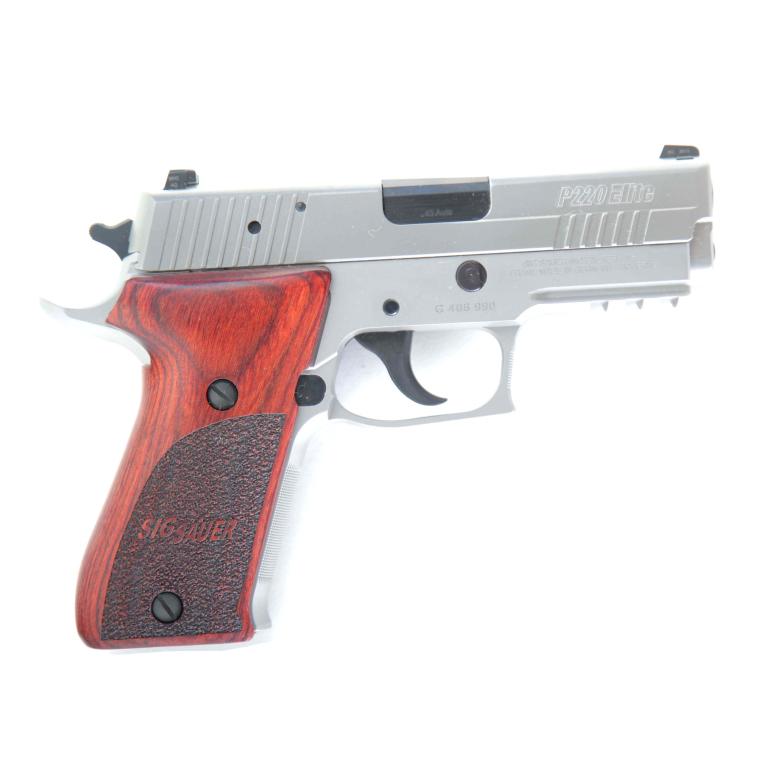 *SIG SAUER P220 ELITE .45 ACP SEMI-AUTOMATIC PISTOL: SIG SAUER P220 CARRY ELITE .45 ACP SEMI-AUTOMATIC PISTOL. American, 21st-century. Stainless steel finish, front cocking serrations, SIGLITE\xa8 night sights, and custom wood grips. 3.9" barrel length,