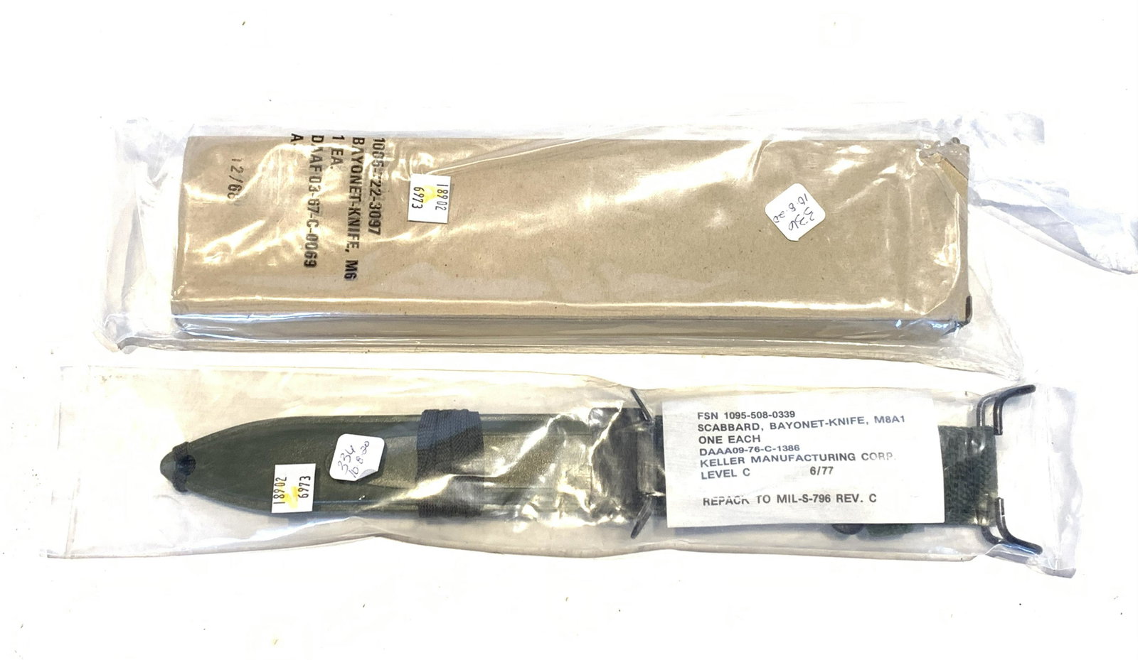 IMPERIAL M6 - 6.75" BAYONET WITH M8 SCABBARD: IMPERIAL M6 - 6.75" BAYONET WITH M8 SCABBARD American. Parkerized blade with black checkered handle. 11-3/8" overall length. Unused, with M8A1 scabbard, both sealed in original packages.