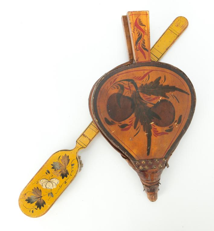 NEW ENGLAND DECORATED BELLOWS AND BRUSH.: Mid 19th century. Original yellow painted grounds with stenciled decoration. Bristle brush, minor wear. 19.25"l. And bellows with old, if not original, leather. Wear, missing nozzle. 14"l.