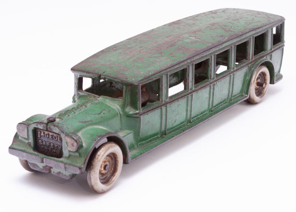 CAST IRON ARCADE "FAGEOL SAFETY COACH".: American, early 20th century. Old green paint. 3"h. 12.25"l.