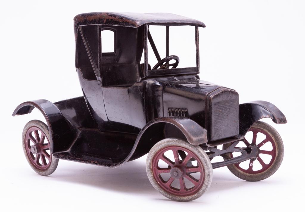BUDDY "L" FLIVVER COUP.: American, ca. 1925. Die cast steel frame in black with cast wheels, 7"h. 10.5"l.