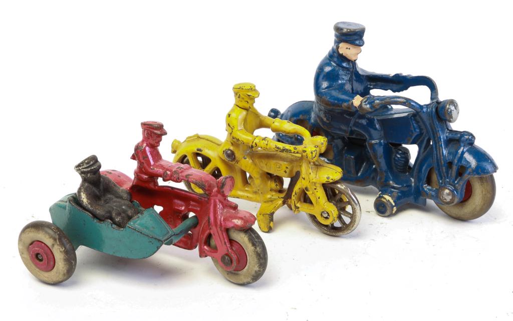 THREE CAST IRON HUBLEY MOTORCYCLE TOYS. (1 of 4)