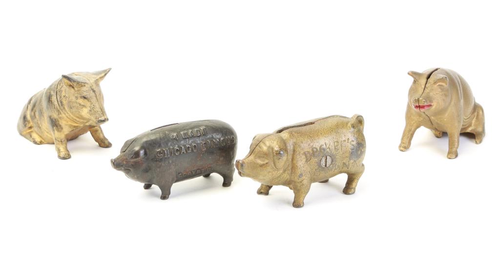 FOUR CAST IRON PIG STILL BANKS. (1 of 3)