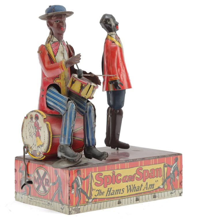 MARX TIN LITHO SPIC AND SPAN WIND-UP DANCERS: American, ca. 1920's. Lithographed tin stage with a dancing man and another playing the drums. Functions properly. 8.5"h., 7"w., 4"d.