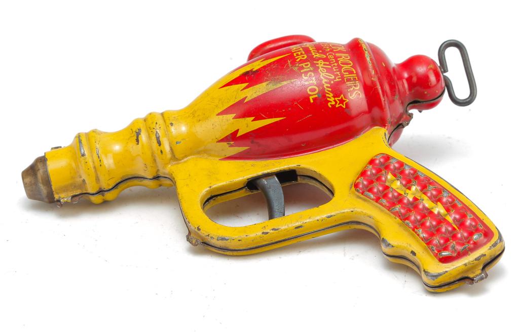 DAISY MFG BUCK ROGERS LIQUID HELIUM WATER PISTOL: American, ca. 1930's. Lithographed tin pistol. One side shows, "Buck Rogers 25th Century Liquid Helium Water Pistol". 7.5"l.