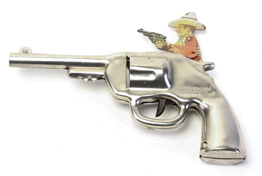 WYANDOTTE TOYS ME & MY BUDDY PISTOL GUN: American, mid 20th century. Metal pistol with lithographed tin cowboy that points and shoots when trigger is pulled. Functions properly. 8" long.