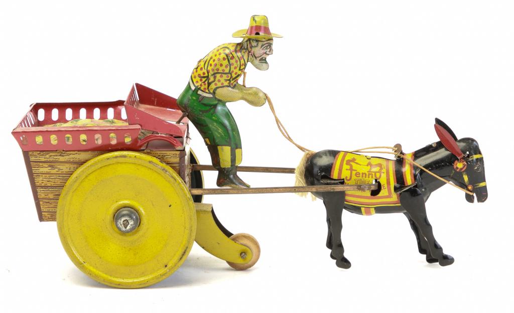 FERDINAND STRUASS JENNY THE BALKING MULE TIN LITHO: American, ca. 1930's. Lithographed wind-up tin fruit cart being pulled my Jenny the mule. Driver holding reins. 5.5"t., 9"l.