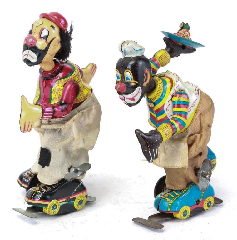 TWO TIN LITHO WIND-UP ROLLER SKATING CLOWNS (1 of 3)