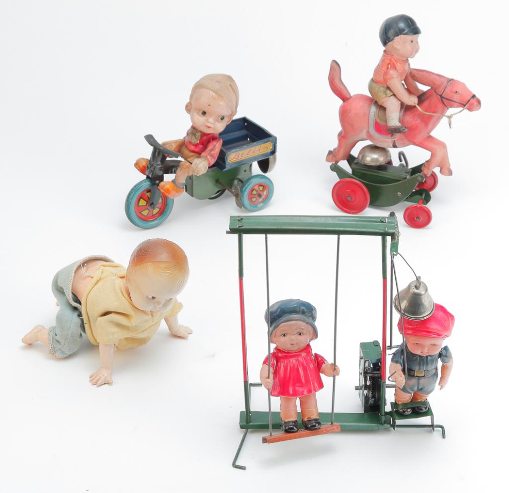 FOUR WIND-UP TIN AND PLASTIC BABY THEMED TOYS (1 of 3)