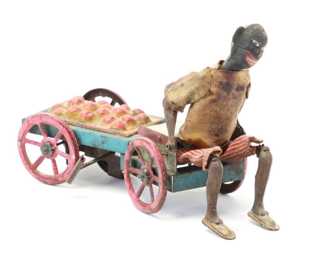 EARLY LITHOGRAPHED TIN FRUIT VENDOR ON CART. (1 of 7)