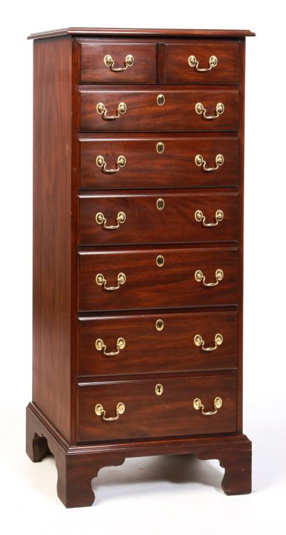 AMERICAN CHIPPENDALE STYLE TALL CHEST.: Made by Henkel Harris, late 20th century, mahogany with oak secondary. Top with routed edge, seven overlapping dovetailed drawers, solid ends and bracket feet. 53"h. 22"w. 16"d.