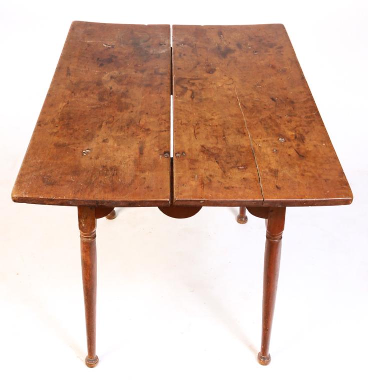 AMERICAN QUEEN ANNE TAVERN TABLE.: Second half 18th century, maple. Two board top, base with pegged construction, deeply scalloped apron and turned legs. Age splits, added screws to top and insect damage. 27"h. 38.5"w. 27.25"d.