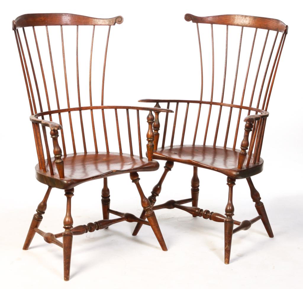 PAIR OF AMERICAN WINDSOR STYLE ARMCHAIRS.: Ca. 1900, mixed woods. Fanbacks with crests with scrolled ears, spindle backs, saddle seats, turned stiles, legs and "H" stretchers. Traces of green paint, refinished, repairs. 18" seat, 45"h.