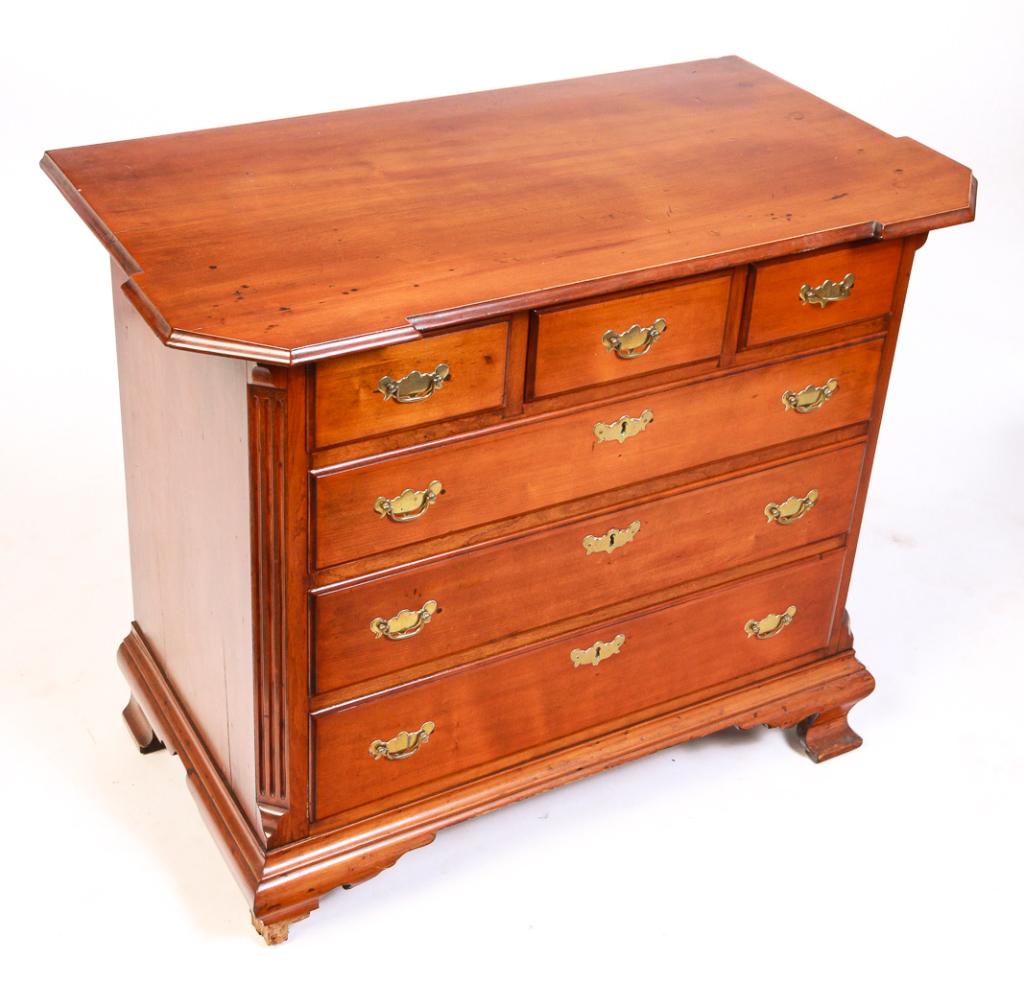 AMERICAN CHIPPENDALE CHEST.: Second half 18th century, cherry with pine secondary. Shaped top with cut corners, dovetailed case with fluted lambs tongue chamfered corners, three over three dovetailed overlapping drawers and ogeeb