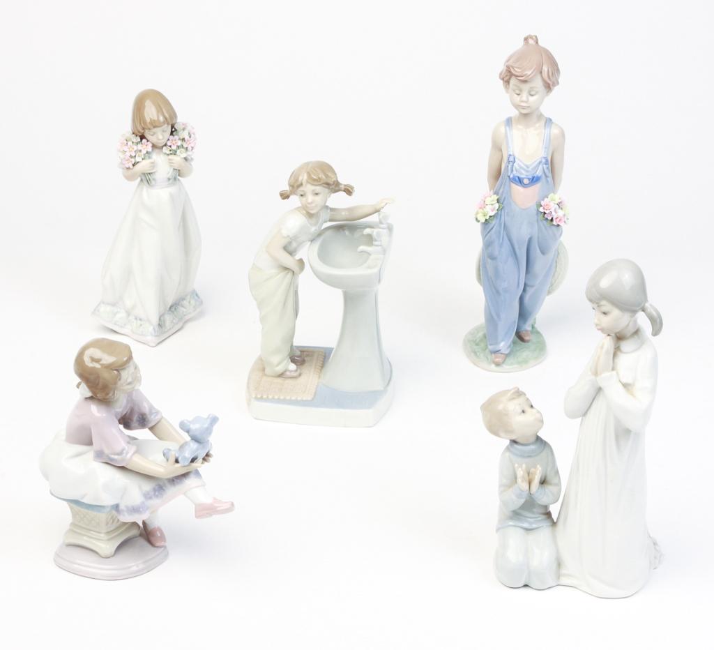 FIVE SPANISH LLADRO FIGURINES.: Late 20th century. Three are Collectors Society: boy in overalls, 10.25"h.; girl with bouquets, 8.25"h.; girl with teddy bear, 6.25"h. With girl with pigtails, 7"h. And children praying, 8.75"h.