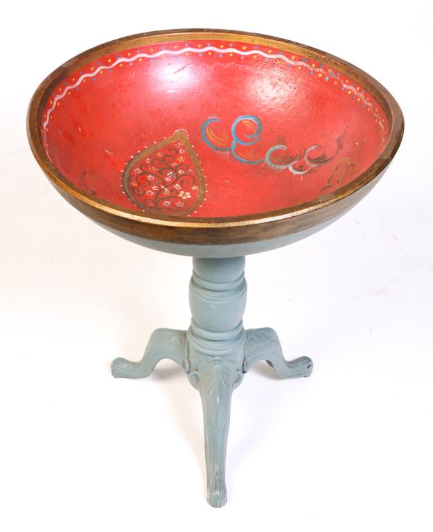 AMERICAN TREENWARE BOWL ON STAND.: Late 19th century. Pine bowl with red painted interior and Pennsylvania Dutch style decoration, bluish grey exterior and cast iron and turned wooden piano stool base, 23"h. 19.5"d.