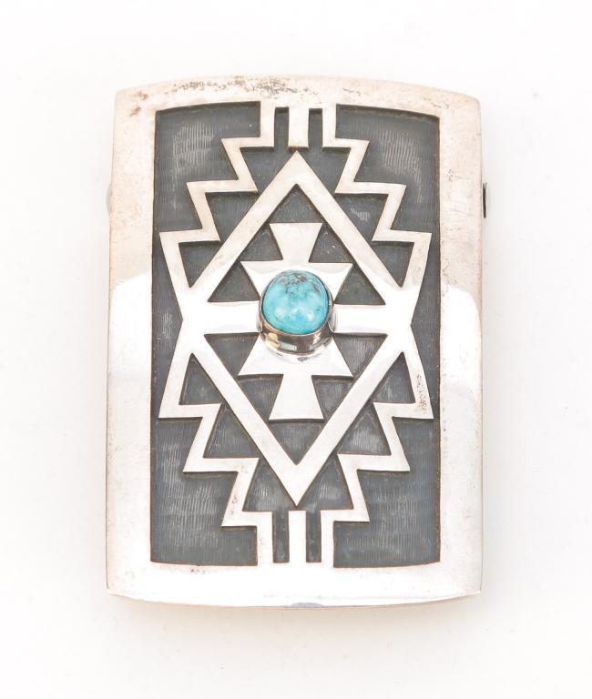 HOPI STERLING OVERLAY BUCKLE - WEAVER SELINA.: Native American, late 20th century. Hopi sterling silver overlay belt buckle, traditional Hopi motif with round cabochon turquoise. Marked sterling and with Weaver Selina's hallmark of a rising sun (o