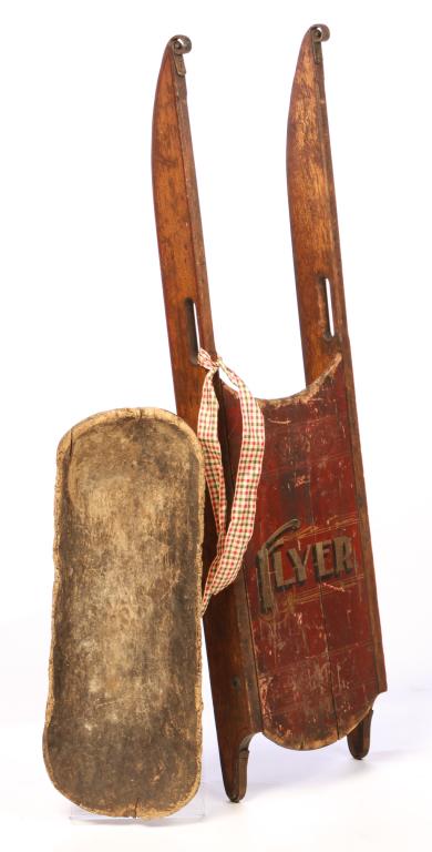 AMERICAN TRENCHER AND SLED.: Nineteenth-early 20th century. Primitive wooden trencher. Insect damage. 3.5"h. 24.5"l. and a wooden sled with steel runners. Impressed designs and original red paint with stenciled "Flyer". Wear. Lab