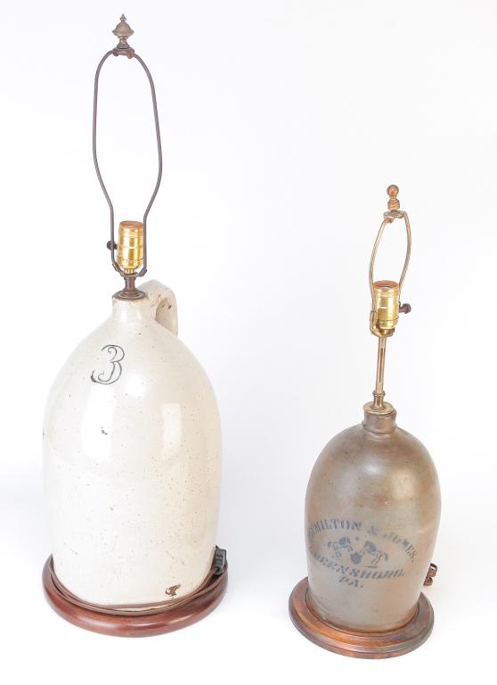 TWO AMERICAN STONEWARE JUG LAMPS.: Fourth quarter 19th century. Cobalt stenciled label "Hamilton & Jones, Greensboro, Pa" with broken handle. 12"h. plus fixtures and a white glaze with stenciled "3", 17"h. Electrified.