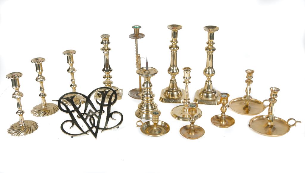 FIFTEEN PIECES OF CONTEMPORARY BRASS.: American, late 20th century. Williamsburg trivet by Virginia Metal Crafters, seven Virginia Metal Crafters candlesticks, Baldwin candlestick, a pair of gimbal chambersticks, single chamberstick, adjus