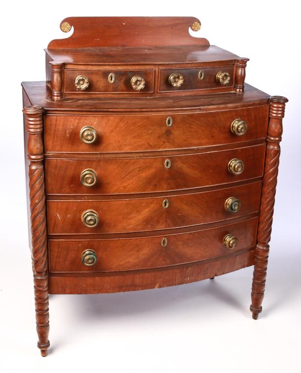 SHERATON BOWFRONT CHEST.: American, 2nd quarter-19th century. Mahogany with pine secondary, dovetailed glove and case drawers have applied beaded molding, biscuit corners and 3/4'' pilasters with rope turnings. 44'' h. 39'' w.
