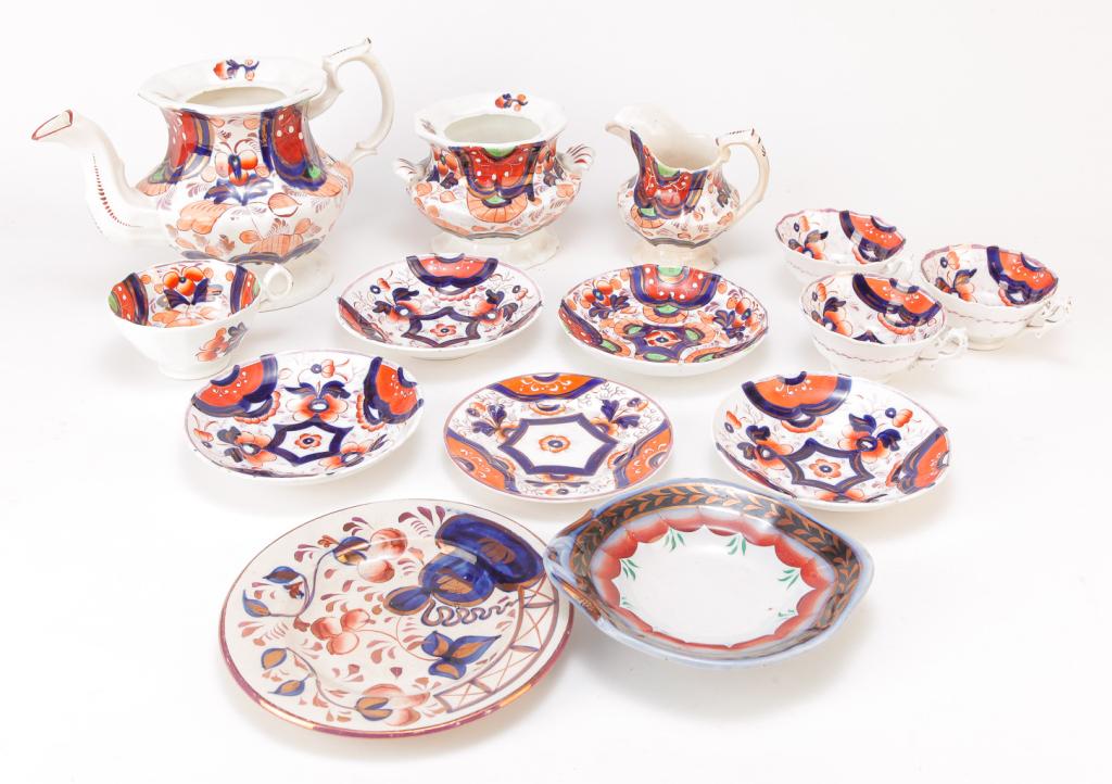 TEN PIECES OF ENGLISH GAUDY WELSH.: Mid 19th century. Teapot (no lid), creamer and sugar, four cups and saucers, two small plates and a shallow handled small bowl.