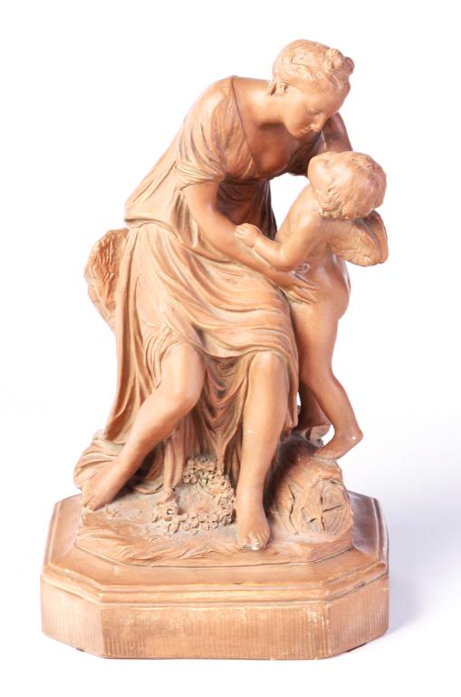 FRENCH TERRA COTTA GROUP AFTER PIGALLE.: Mid 19th century. Gowned seated woman with cherub on square plinth with cut corners. Signed under cherub's feet "JB Pigalle". 16.5"h.