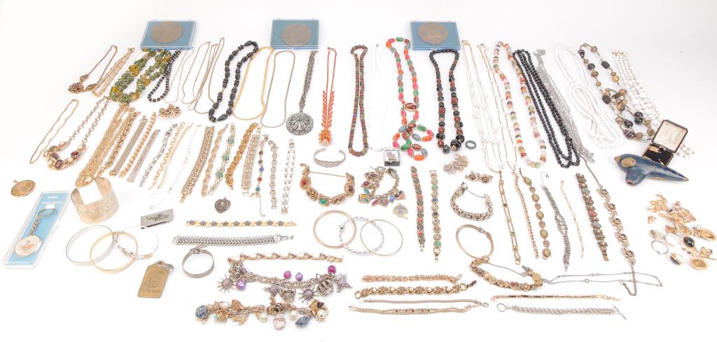 COLLECTION OF COSTUME JEWELRY.: Mid-late 20th century. Nice variety of bracelets (two sterling), brooches, earrings, sweater clips, charms, necklaces, etc. - many with rhinestones (several missing stones), some enamel. Signed pieces