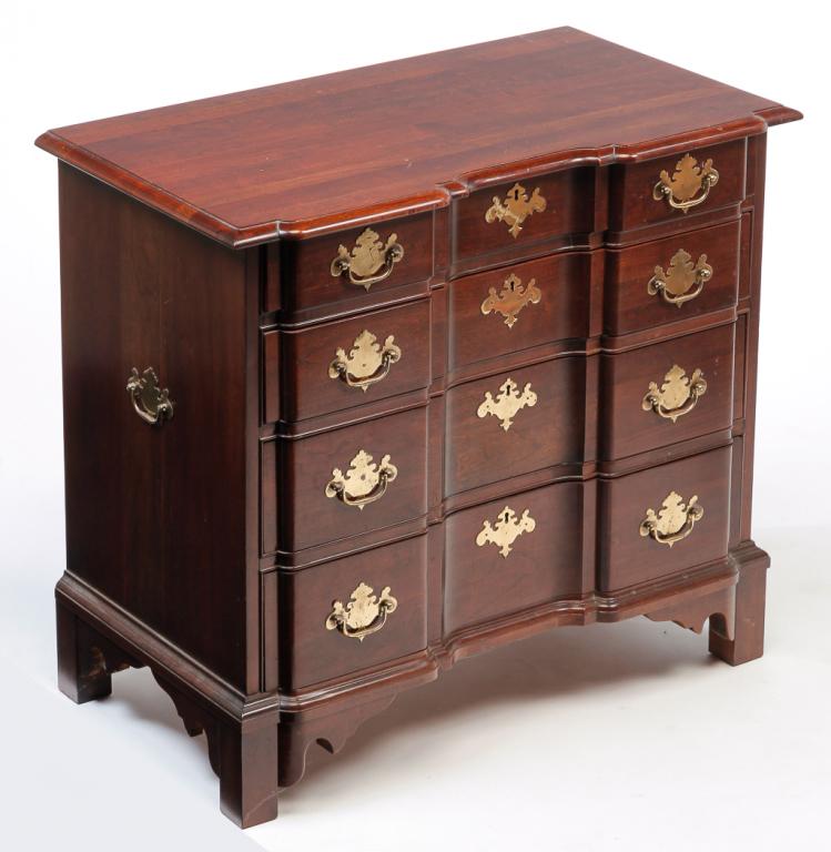 AMERICAN "PENNSYLVANIA HOUSE" BLOCKFRONT CHEST.: Late 20th century, cherry. Shaped top with routed edge, four drawers, square legs and cut out ends and apron. 31"h. 34.5"w. 19.25"d.