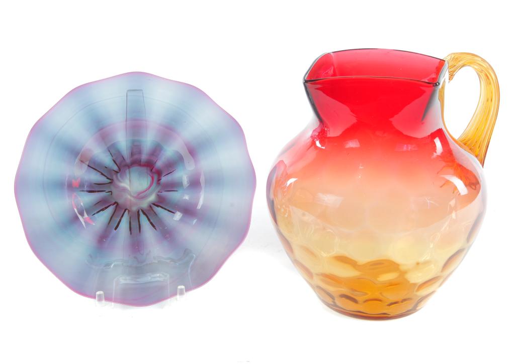 TWO PIECES OF ART GLASS.: American, 19th century. An Alexandrite plate with ribbing and polished pontil, 6.75"dia. And a New England Glass CO. Amberina pitcher with reeded handle and polished pontil, 7"h.