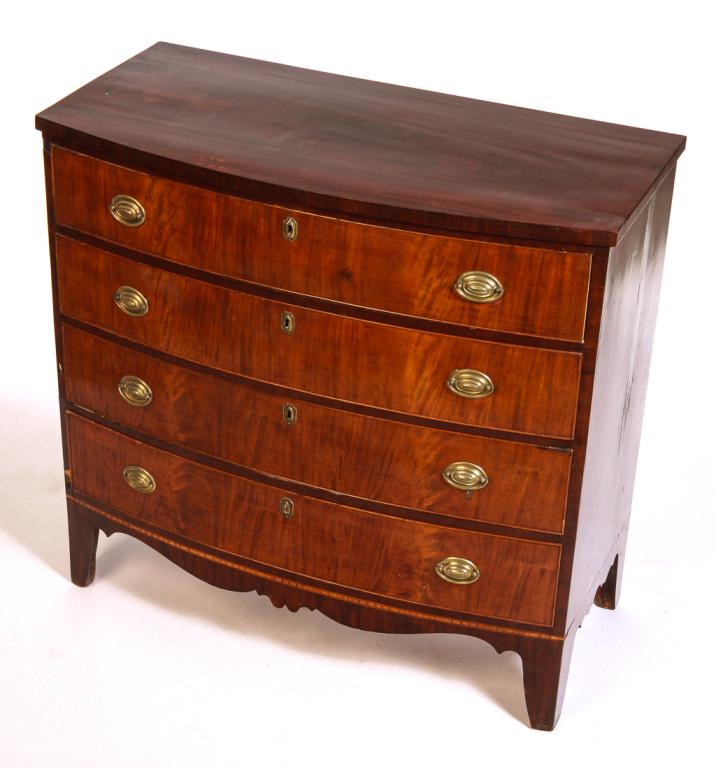 AMERICAN HEPPLEWHITE BOWFRONT CHEST.: Ca. 1800, mahogany with pine secondary. Four dovetailed drawers with applied beading, banded veneer, high legs with scalloped ends and apron. Some veneer damage, some missing beading. 38.5"h. 40.5"w. 