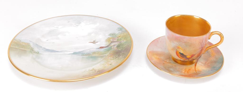 TWO PIECES OF ENGLISH CHINA.: Twentieth century. Royal Worcester demitasse cup and saucer with pheasant and gold lining. And a Minton plate with ducks signed "A. Holland", 6.25"d.