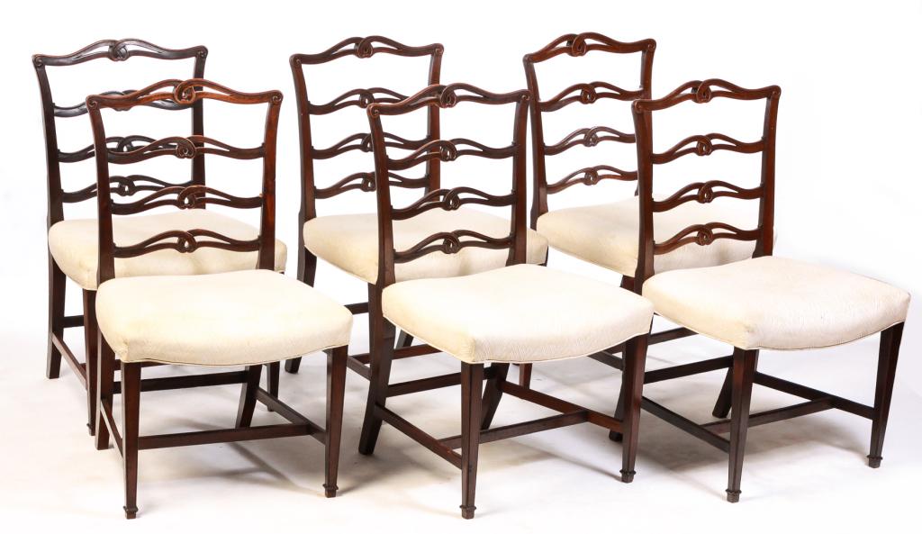 SIX ENGLISH HEPPLEWHITE STYLE DINING CHAIRS.: Second half 19th century, mahogany. Ribbon backs, tapered front legs with lower cuffs, "H" stretchers and upholstered seats. Wear and repair. 18" seat, 36.5"h.