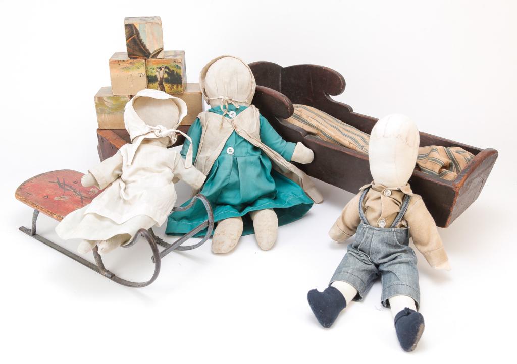 GROUP OF AMERICAN CHILDREN'S TOYS.: Nineteenth-20th century. Pine doll cradle with dovetailed case, old worn brown paint and pillow tick mattress. Wear and damage, 8.75"h. 10.75"w. 19.5"d., doll size sled with floral decorated red seat,